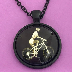 Skeleton Riding Bike Glow in the Dark Necklace